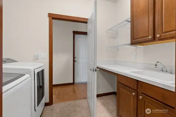 Laundry room flows to hallway