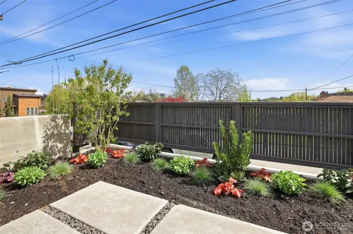 Private fenced patios off the main living area. Private fenced patios off the main living area.