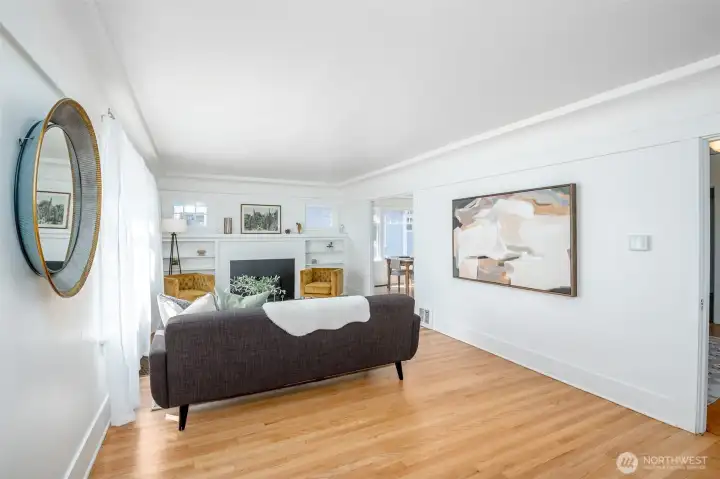 The living room is full of beautiful natural light, with windows on all three sides. The living room is full of beautiful natural light, with windows on all three sides.