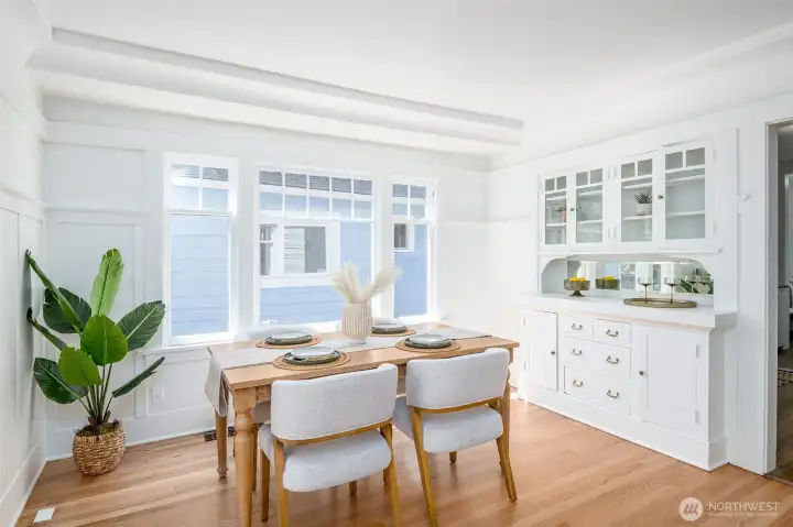 This beautiful dining room showcases original built-ins with glass-front cabinets and lower drawers, adding both charm and functionality. This beautiful dining room showcases original built-ins with glass-front cabinets and lower drawers, adding both charm and functionality.