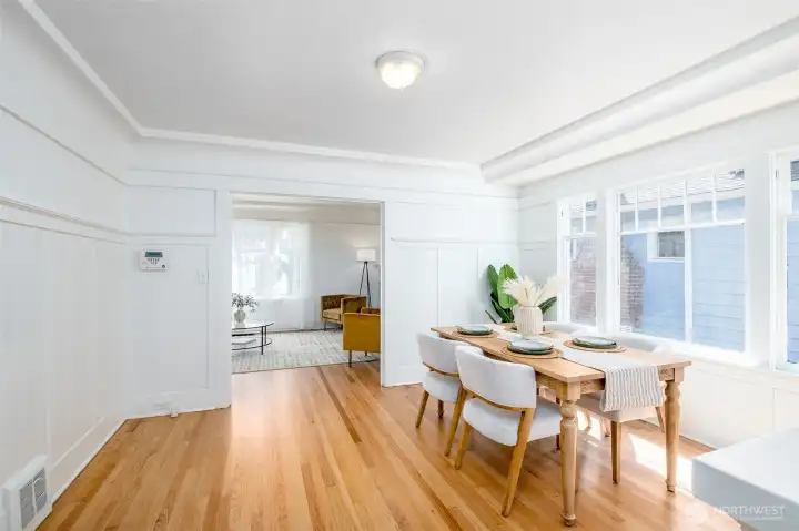 The dining room is conveniently located between the kitchen and living room. The dining room is conveniently located between the kitchen and living room.