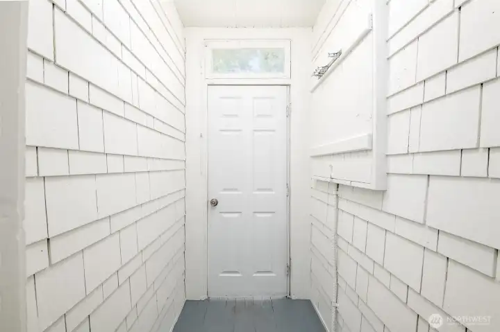 This mud room, leading to the backyard is just off the kitchen. This mud room, leading to the backyard is just off the kitchen.