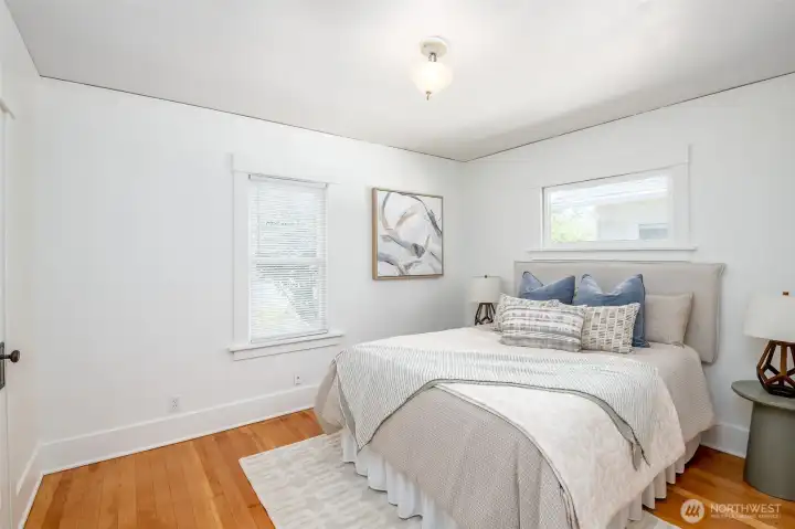 This bright bedroom is located at the back of the house. This bright bedroom is located at the back of the house.