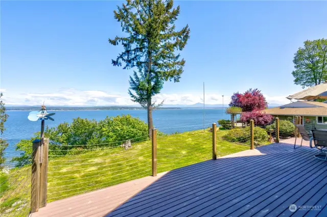 Large deck with ocean and mountain views.