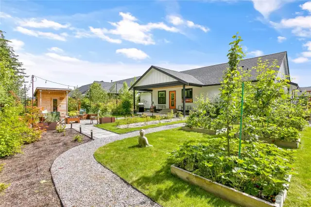 Fruit trees, berries and lots of space for raised bed gardening.