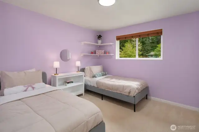 Bedroom 2 with custom shelves in closet.