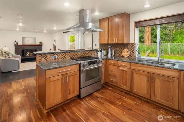 Jennair gas range and SS hood vent make cooking in this kitchen a dream!