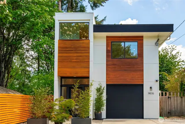 Welcome to a fabulous modern style 2 story home surrounded by trees located in Northeast Seattle.
