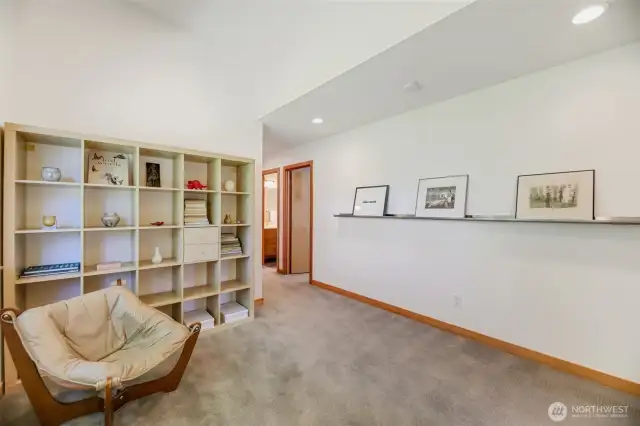 Functional loft space at the top of the stairs perfect for a library/office. Large window & room for lots of art & books.