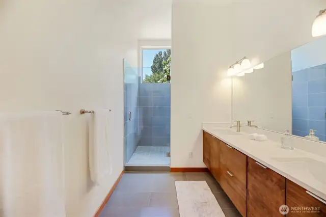 Heated Tile floors, double sinks & a linen closet.