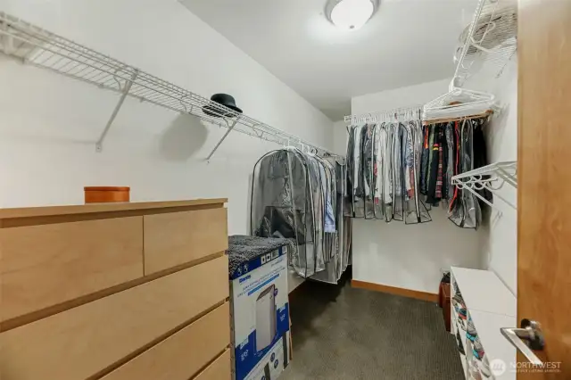 Primary bedroom large walk-in closet.