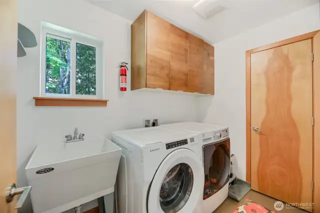 Laundry room w/ utility sink and more storage