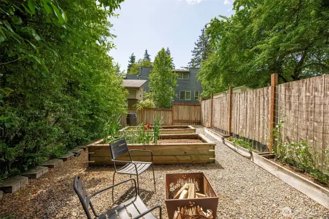Don't miss the garden area with raised beds & rainwater barrel. Perfect vegi growing space with southern exposure. Possible area to add a studio or a small DADU.