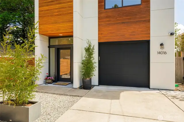 Cement planked siding and natural cedar cedar accents.
