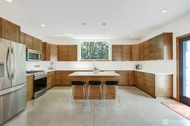 Beautiful kitchen feat. gas range, SS appliances & Quartz Countertops.