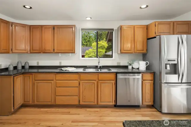The spacious kitchen has granite counters, pantry, stainless steel appliances and eating nook.