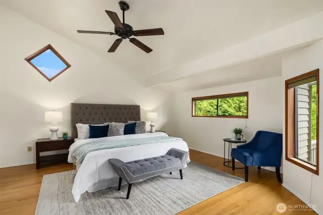 Primary bedroom upstairs with vaulted ceiling, walk in closet and 5-piece bath.