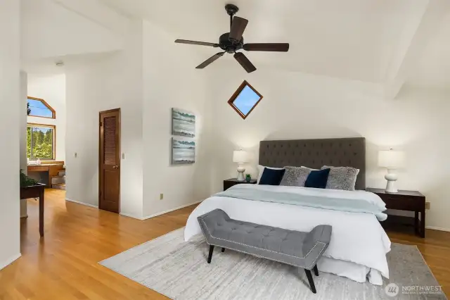Primary bedroom upstairs with vaulted ceiling, walk in closet and 5-piece bath.