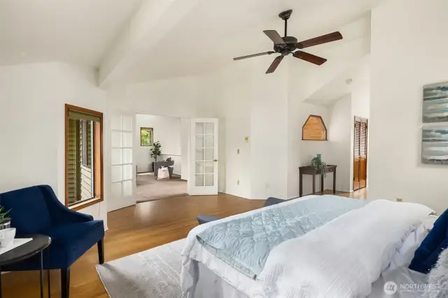 Primary bedroom upstairs with vaulted ceiling, walk in closet and 5-piece bath.