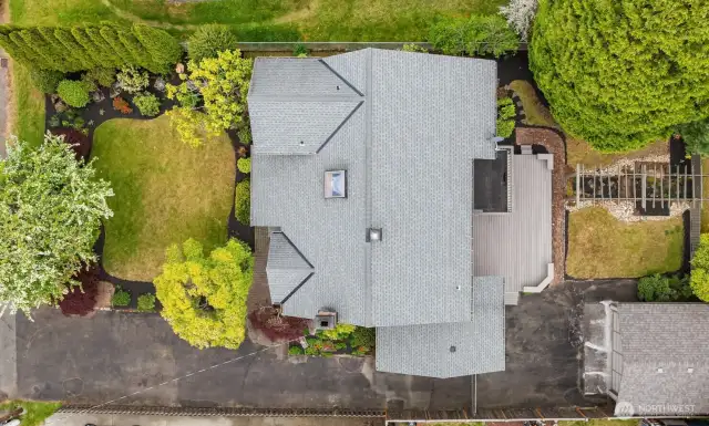 The the versatile level lot has plenty of space for gardening, playing, parking, and is well landscaped.