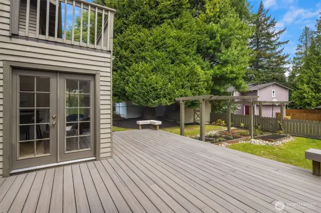French doors from the sun room lead out onto the newer deck.