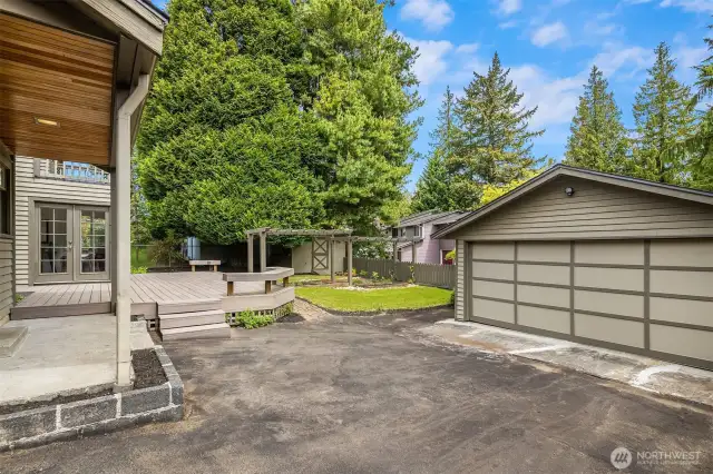 Detached garage with extra driveway space.