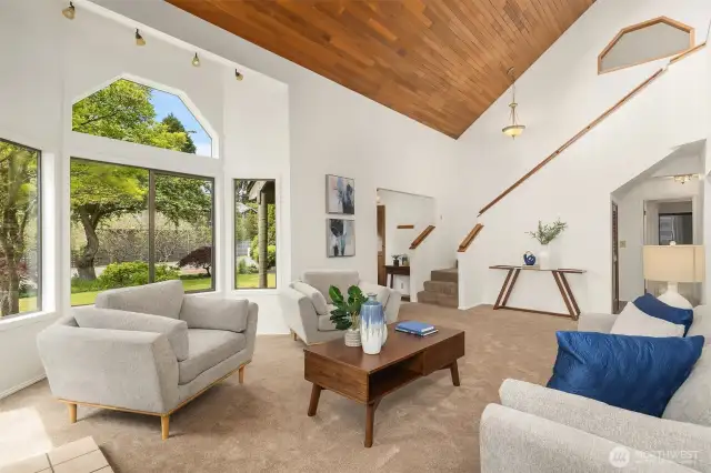 Living room looking back towards the front entry and open staircase.