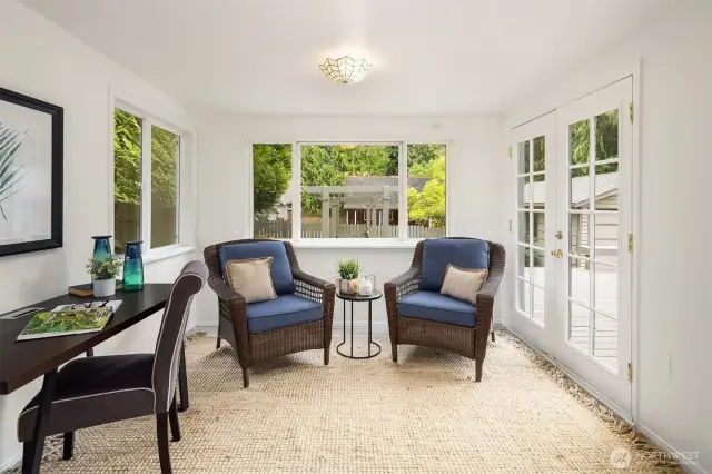Sun room/office with french doors out to the deck and backyard.