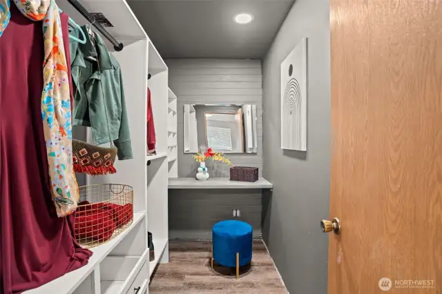 Primary closet with custom built in closet organizing system