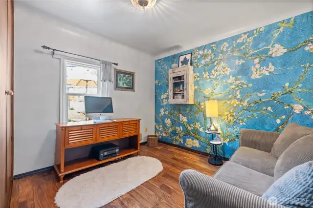 main floor bedroom with accent wall