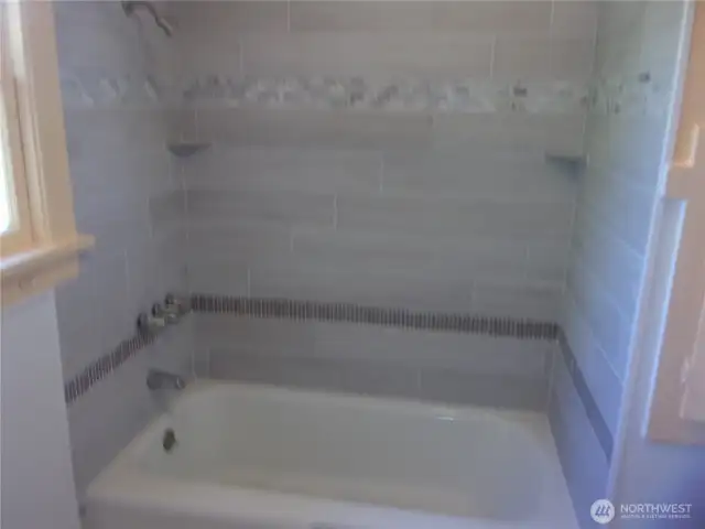 New tile around the tub/shower combination.