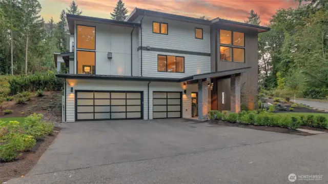 Nestled in a serene, forested enclave, this contemporary residence offers a striking yet tranquil retreat, where bold design meets thoughtful craftsmanship. Outside, enjoy a gorgeous, low-maintenance sanctuary with turf lawns, landscaped terraces and sprinkler system, all surrounded by lush forest. At dusk, landscape lighting illuminates the lush flora, creating a magical ambiance, frequently visited by a friendly family of deer.