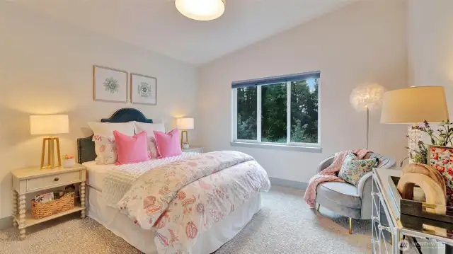 Upper level bedroom with organized closet and custom blinds.