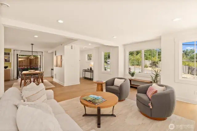 The living room offers space to unwind while being connected to other rooms....
