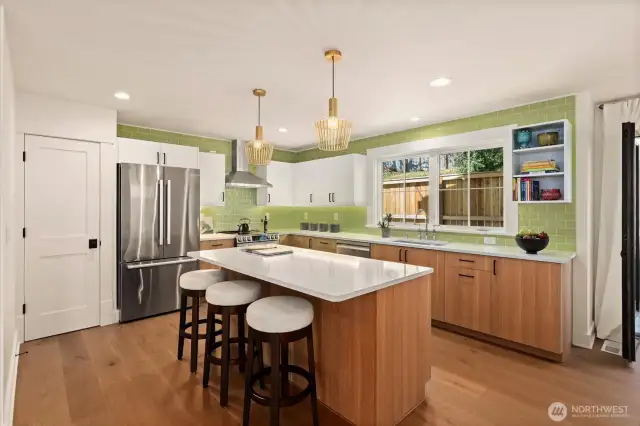 Designer apple green tile adds a flare as you entertain with family and friends alike. Center island becomes a natural epicenter for activity....