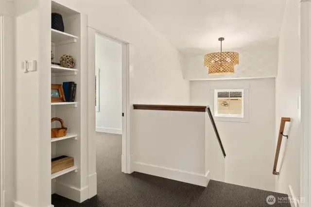 Communal landing upstairs connects bedrooms.