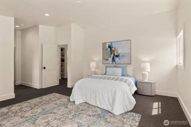 Primary bedroom offers a private corner of the home with vaulted ceilings, tons of space and a spa-like bathroom suite with heated floors, soaking tub and double sinks....
