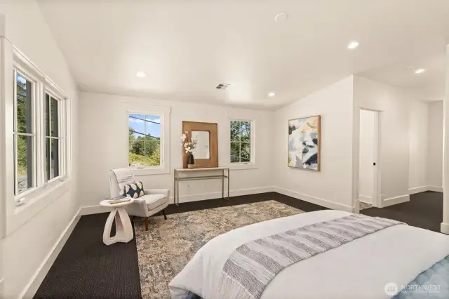 Spaciously appointed primary suite abounding in natural light.