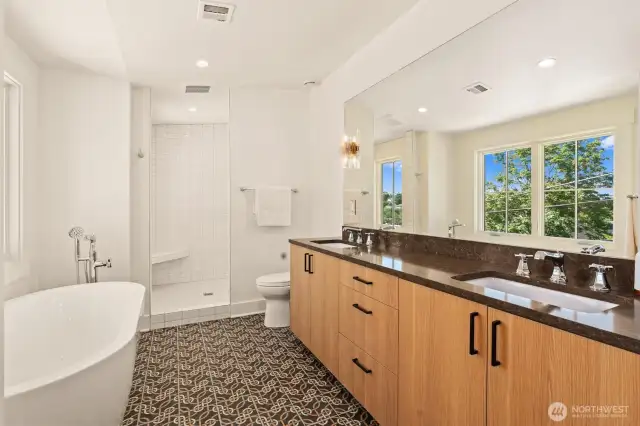 Spacious primary en suite bath with heated floors. Soaking tub, separate shower and dual sinks....