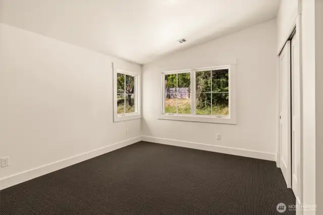 SW corner guest bedroom upstairs. Vaulted ceilings to increase light exposure for NW days....