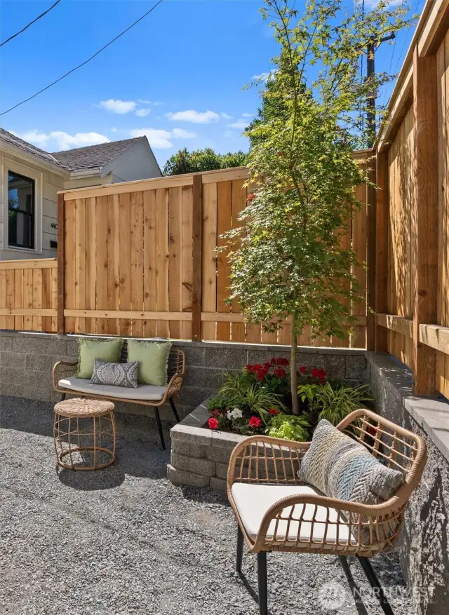 Small yard offers green space with easy-to-maintain areas.
