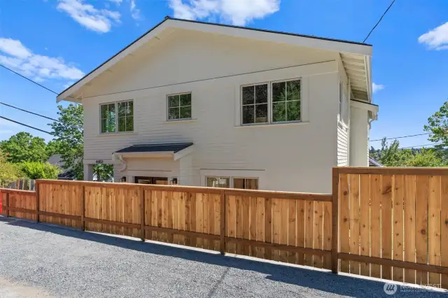 Privately situated with thoughtfully designed hardscaping and fences offer an airy & open urban oasis. Small yard offers plenty of space for pets or a modified dog run.