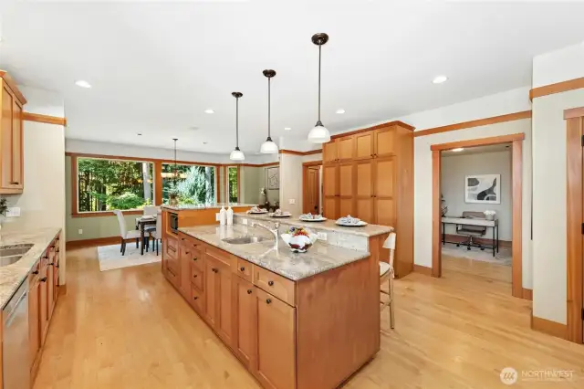 Gorgeous crafted kitchen with solid VG fir cabinets, granite, stainless appliances! Mudroom and 2nd office/etc off of this space.