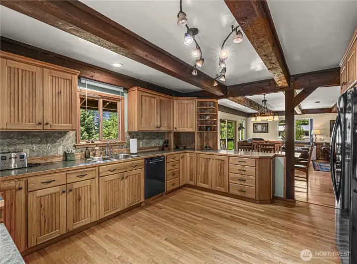 Kitchen window looking at yard, mountains, and river