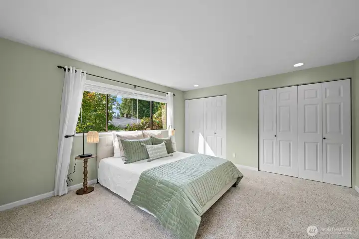 Primary bedroom that overlooks patio. 2 full closets.