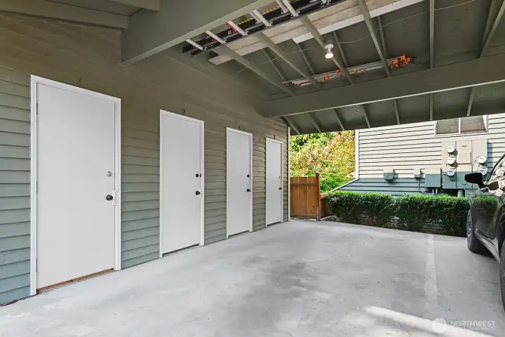 Covered carport off of alley, with large storage closet. Unit's is #4.