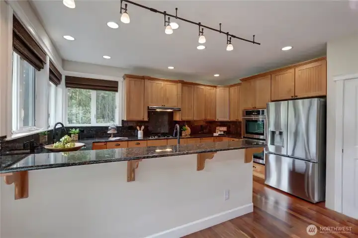 Large peninsula Kitchen with double ovens, new refrigerator & golf course views.