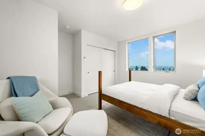 2 of 3 upstairs bedrooms with views of Greenlake and The Cascades.