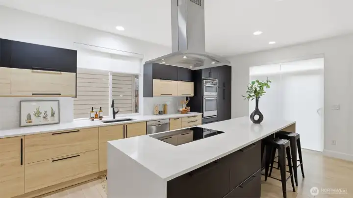 Chef’s kitchen with statement island and clean lines, a stylish hub for everyday life.