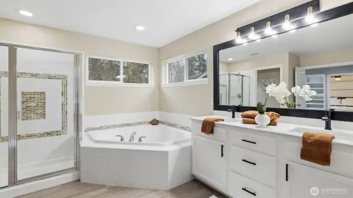 Spa-inspired 5-piece ensuite with separate shower and deep soaking tub.